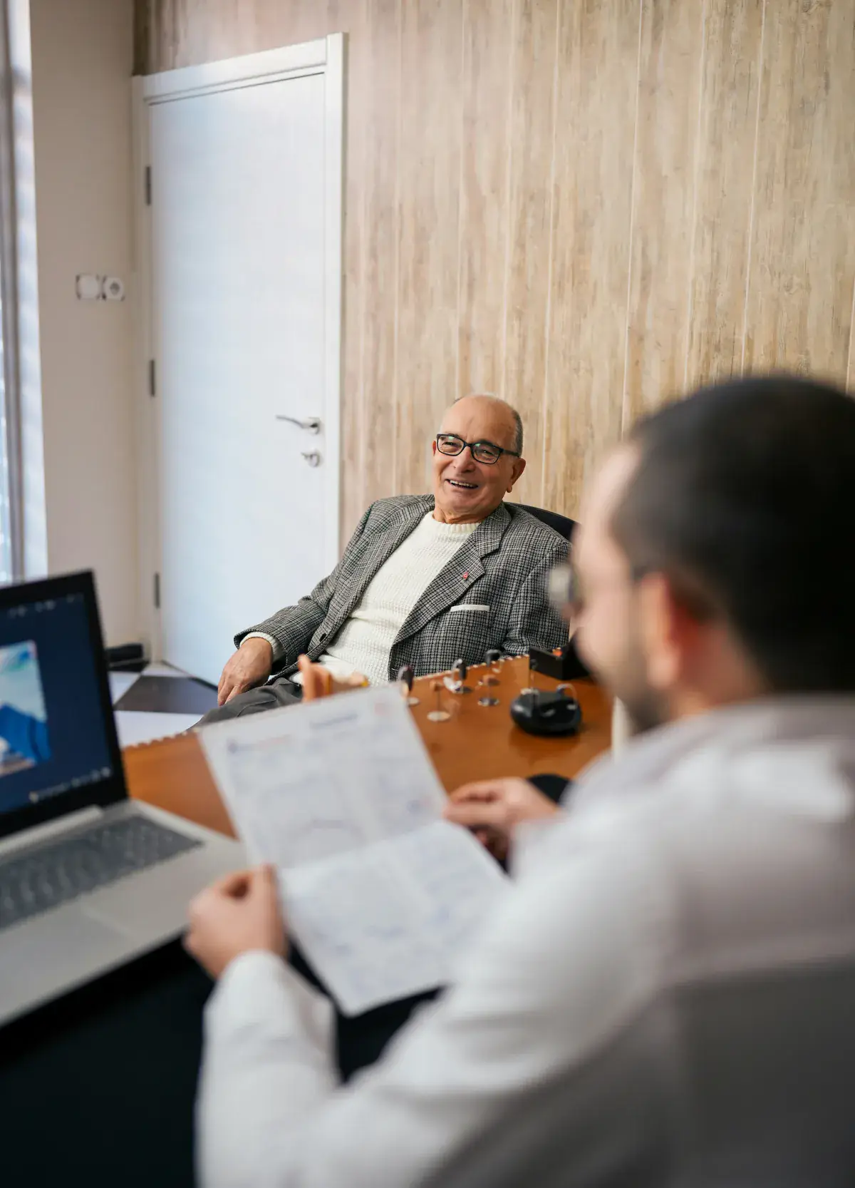 Financial advisor meeting a client across a desk